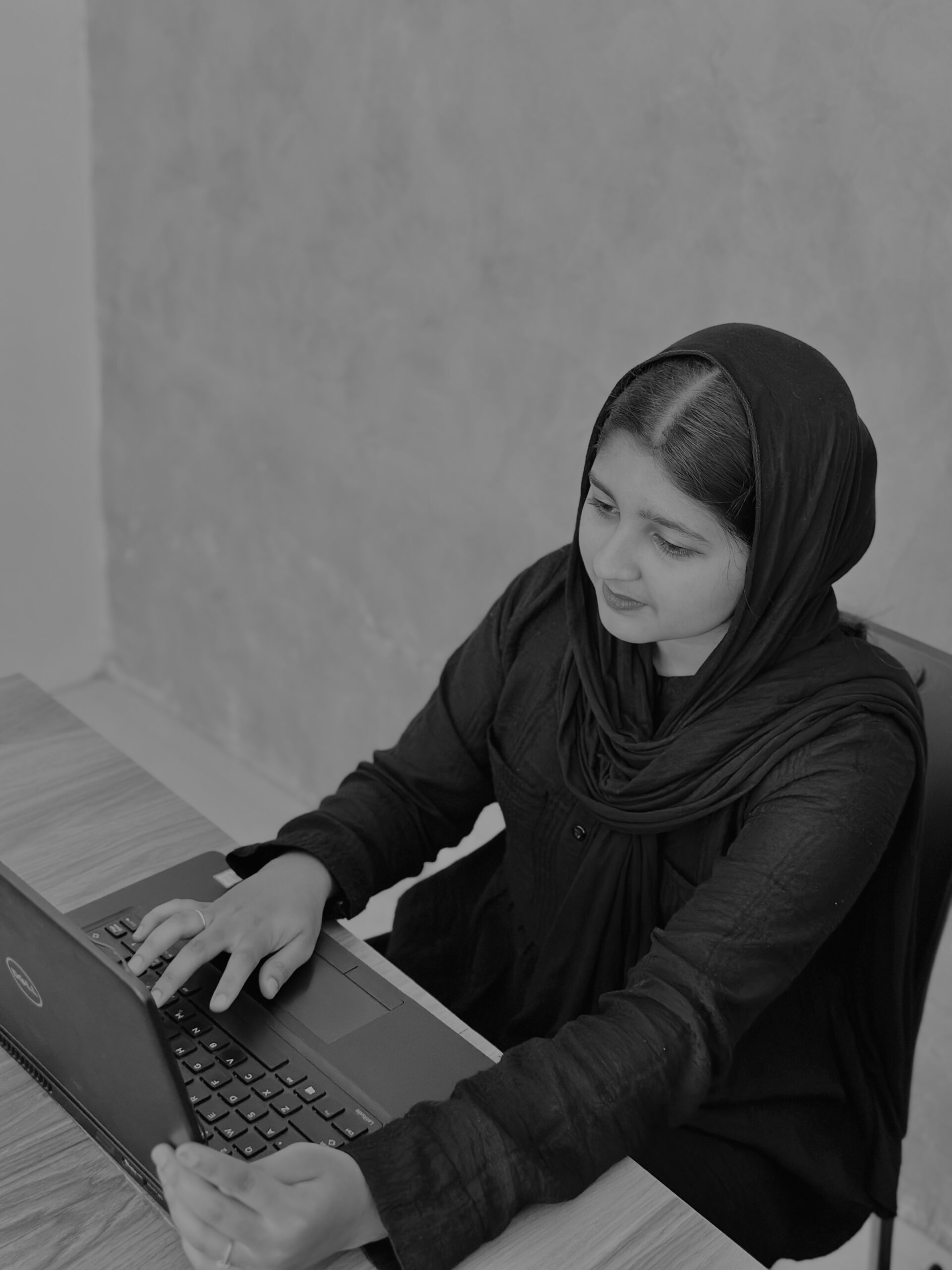 Digital marketer working on laptop – Fathima Shifna, SEO expert and digital marketer in Malappuram