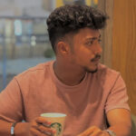 Satisfied digital marketing client in a modern café setting